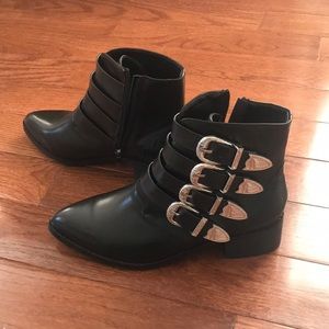 black pointed buckle boots